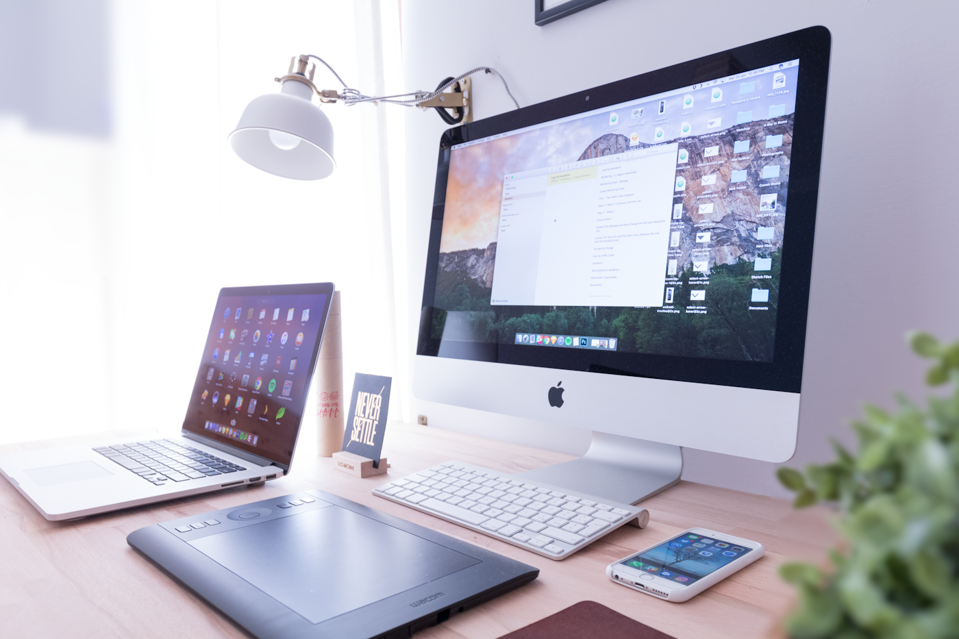 A clean home workspace with a desktop computer, laptop and smartphone — typical setup for browsing the web on Chrome.